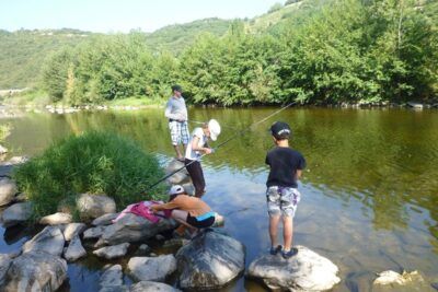 Fishing in the river flowing past the camp-site
